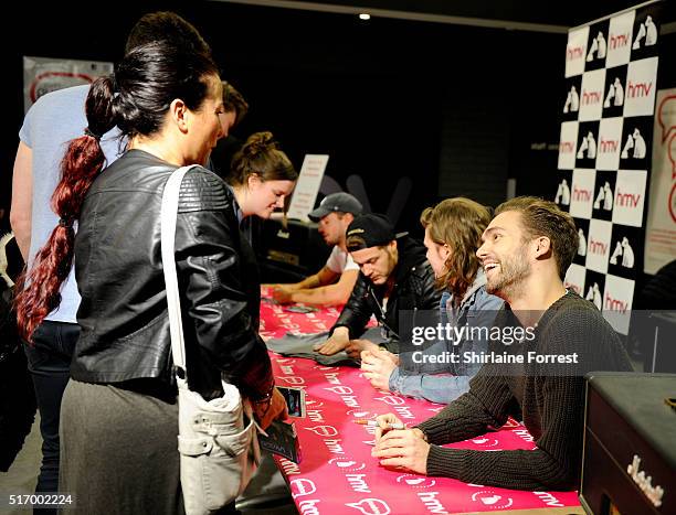 Andy Brown, Ryan Fletcher, Joel Peat and Adam Pitts of Lawson meet fans and sign copies of their new single 'Money' at HMV on March 22, 2016 in...