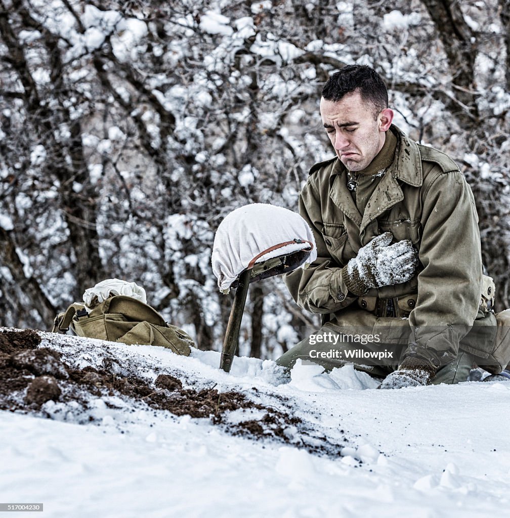 WWII US Army Soldier Kneeling Crying Mourning For Dead Buddy