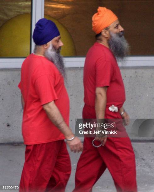 Accused Air India bombers Ajaib Singh Bagri and Ripudaman Singh Malik walk together through the exercise yard at the jail where they are in custody...