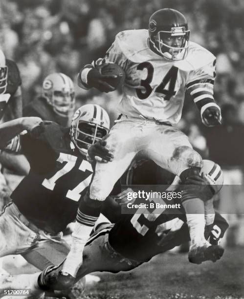 Walter Payton of the Chicago Bears runs the ball during an NFL game against the Green Bay Packers. Walter Payton played in the NFL from 1975-87.