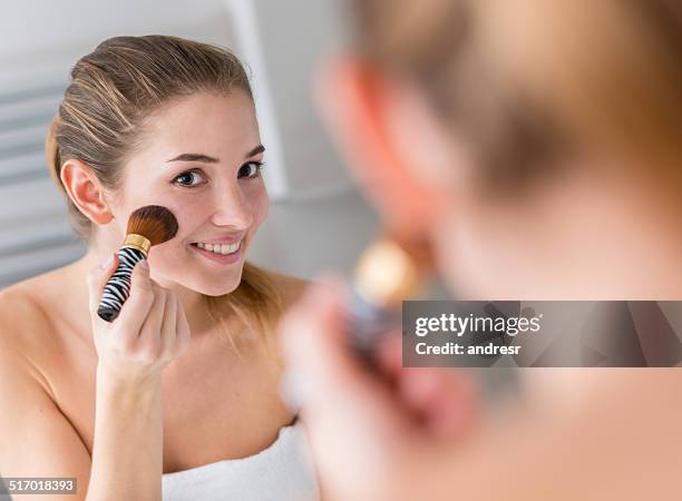 woman applying blusher - contour drawing stock pictures, royalty-free photos & images