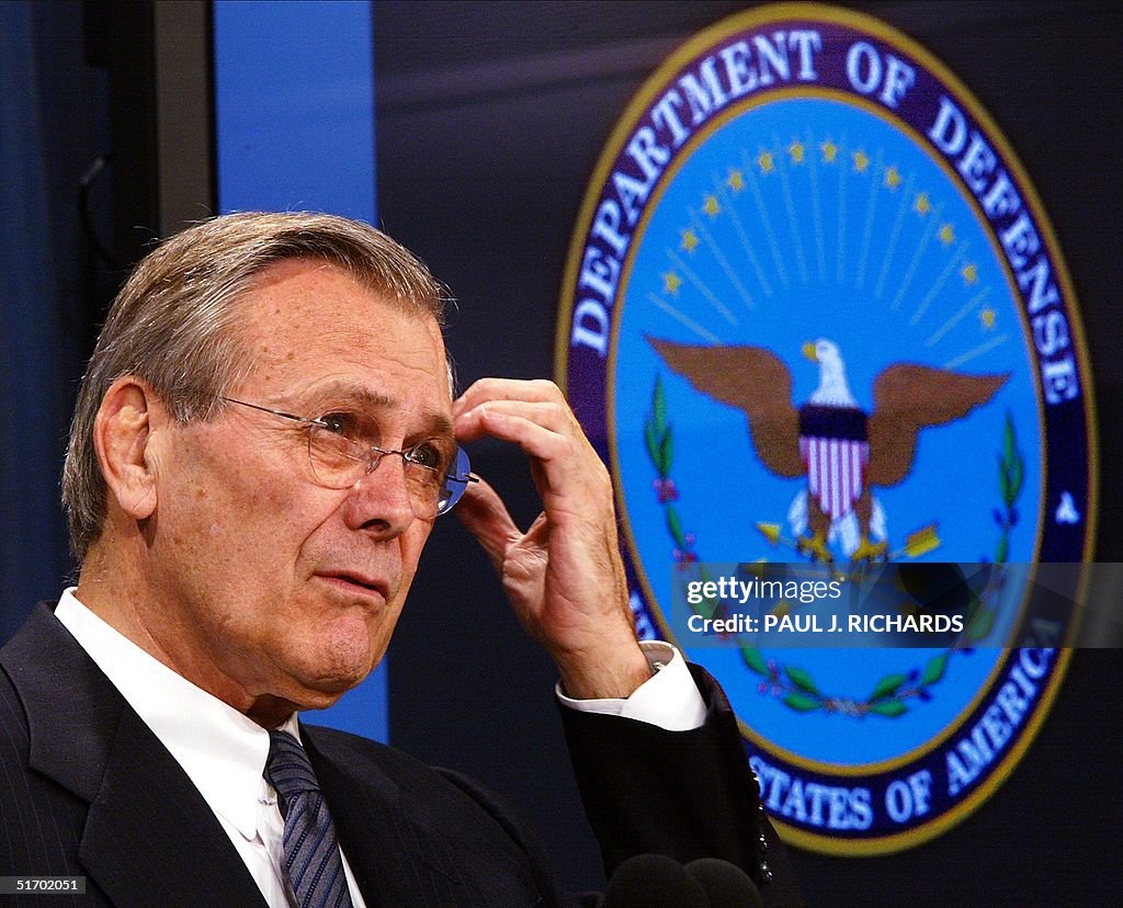 Secdef Rumsfeld US Secretary of Defense Donald H. Rumsfeld pauses as he calls on a ...