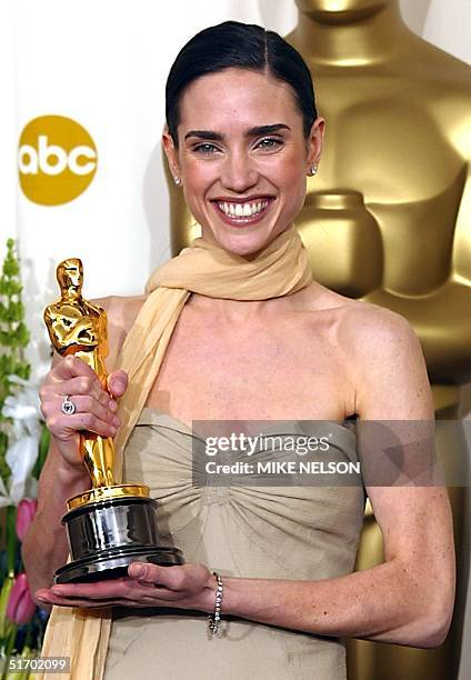 Actress Jennifer Connelly holds her Oscar or best actress in a supporting role for her portrayal of Alicia Nash, the wife of mathematician John Nash,...