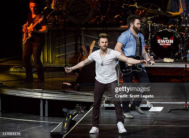 Colton Swon and Zach Swon of the Swon Brothers perform during The Storyteller Tour 2016 at The Palace of Auburn Hills on March 22, 2016 in Auburn...