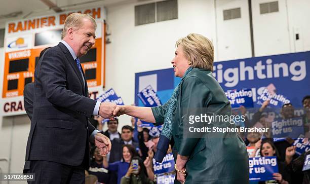 Democratic presidential candidate Hillary Clinton, right, shakes hands with Seattle Mayor Ed Murray, who had just endorsed Clinton, during a rally at...