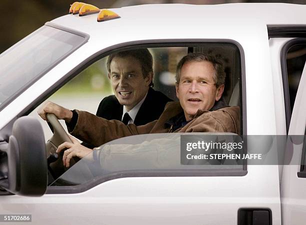 President George W. Bush drives with British Prime Minister Tony Blair in his truck after Blair arrived at the Bush's Prairie Chapel Ranch 05 April...