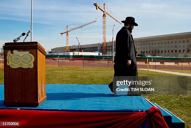 Rabbi Levi Shemtov, Washington director of the American Friends of Lubavitch, walks off stage at the end of a memorial service sponsored by the group...