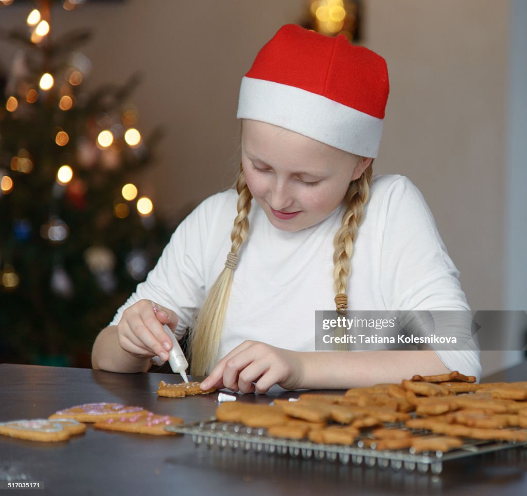 Girl preparing christmas gingerbread cookies