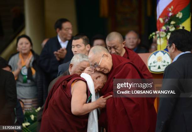 His Holiness the Dalai Lama greets his former physician Dr Yeshi Dhonden during the Centenary celebration of the Men-Tsee-Khang in McLeod Ganj on...