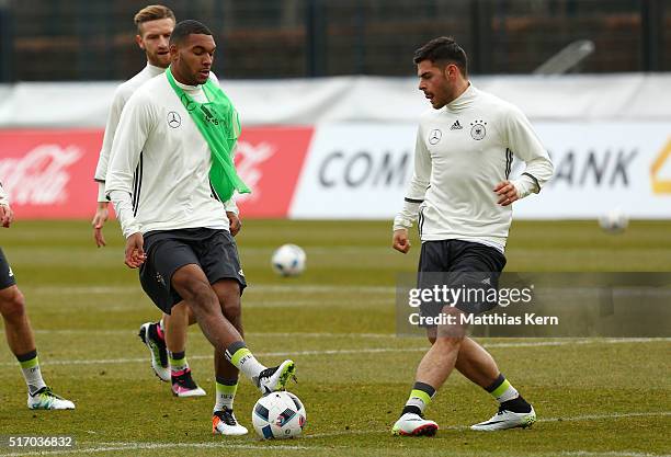 Jonathan Tah of Germany battles for the ball with Kevin Volland during a Germany training session ahead of their International friendly match against...