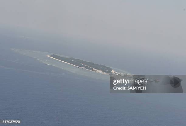 This aerial image taken from a C-130 transport plane shows a general view of Taiping island during a visit by journalists to the island, in the...