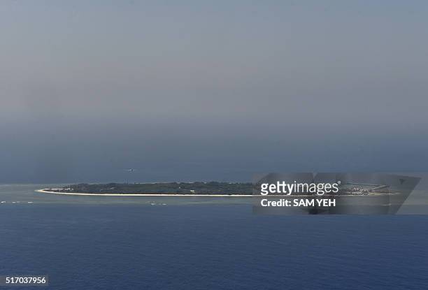 This aerial image taken from a C-130 transport plane shows a general view of Taiping island during a visit by journalists to the island, in the...