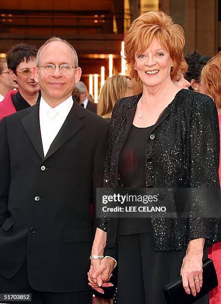 British actress Maggie Smith arrives with producer Bob Balaban , 24 March, 2002 at the Kodak Theater in Hollywood, CA. Smith is nominated for best...