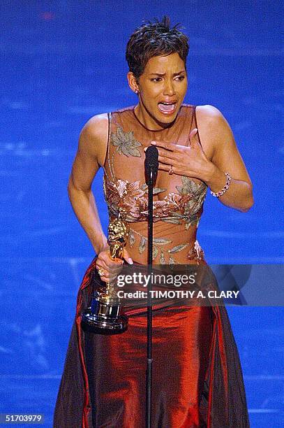 Actress Halle Berry accepts her Oscar for Best performance by an actress in a leading role during the 74th Academy Awards at the Kodak Theatre in...