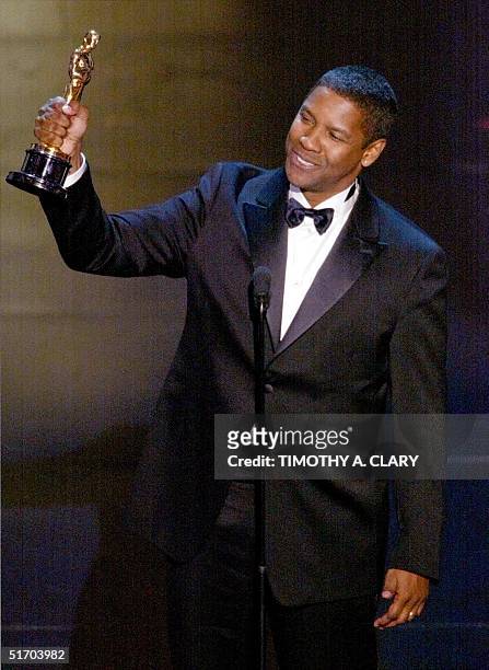 American actor Denzel Washington accepts his Oscar for Best performance by an actor in a leading role, at the 74th Academy Awards at the Kodak...