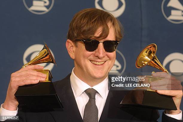Producer T Bone Burnett holds two Grammys, one for Producer of the Year, Non-Classical for "O Brother, Where Art Thou?" at the 44th Annual Grammy...