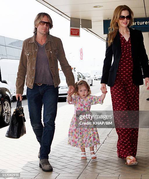 Nicole Kidman husband, Keith Urban and daughter Sunday Rose at Sydney airport on December 23, 2010 in Sydney, Australia.