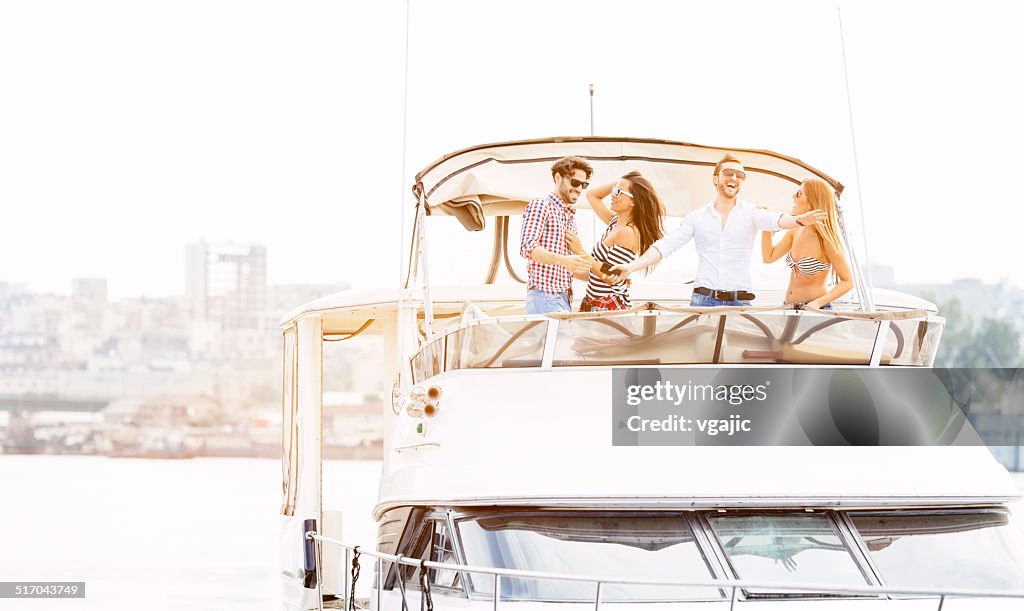 Young People Drive Yacht and having fun.