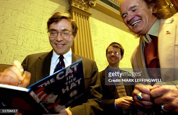 Feigning ignorance in the world of physics, Colorado State Senator Ken Chlouber gets smiles from Nobel Laureates Dr. Carl Wieman and Dr. Eric Cornell...