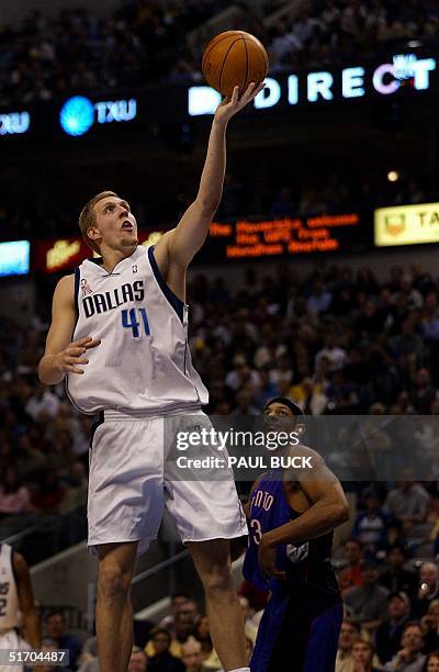 Jerome Williams of the Toronto Raptors can only watch as Dirk Nowitzki of the Dallas Mavericks soars to the basket during second half action at...