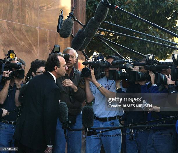 Wendell Odom , one of the defense attorneys for Andrea Pia Yates, listens to reporters' questions outside the Harris County Courthouse in Houston,...