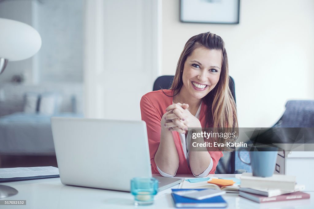 Portrait of a content, smiling young woman