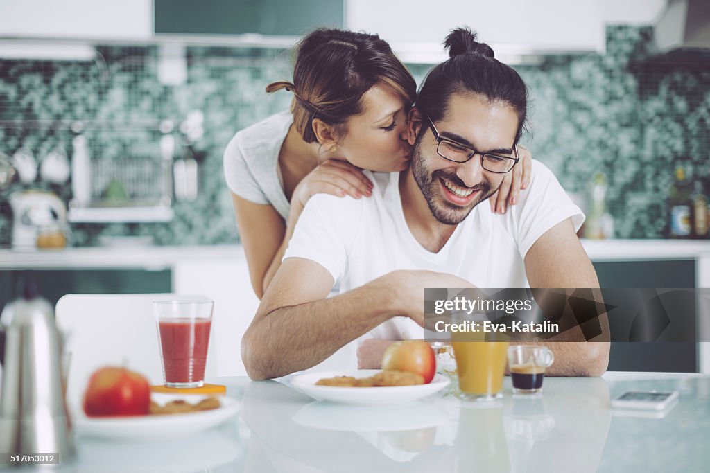 Young couple having breakfast