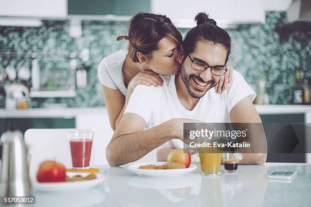 young couple having breakfast - eva long stock pictures, royalty-free photos & images