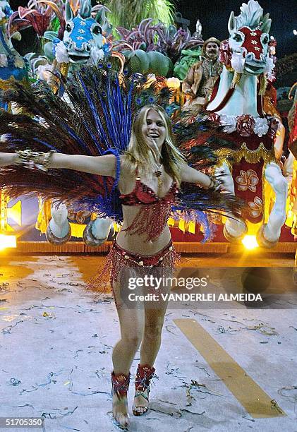 Brazilian model and actress, Susana Werner dances the second day of the carnival parade at the Marques de Sapucai sambadrome in Rio de Janeiro,...