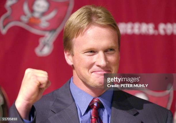 Tampa Bay Buccaneers' new Head Coach Jon Gruden celebrates as he is introduced at a press conference 20 Febuary 2002 in Tampa, Florida. At 38, Gruden...