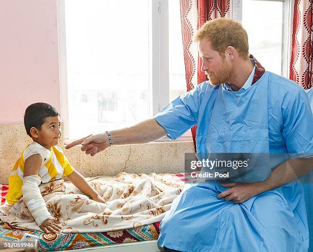 Prince Harry meets young burns victim Biplov Puri, 4 at Kanti Children's Hospital on the final day of his tour of the country on March 23, 2016 in...