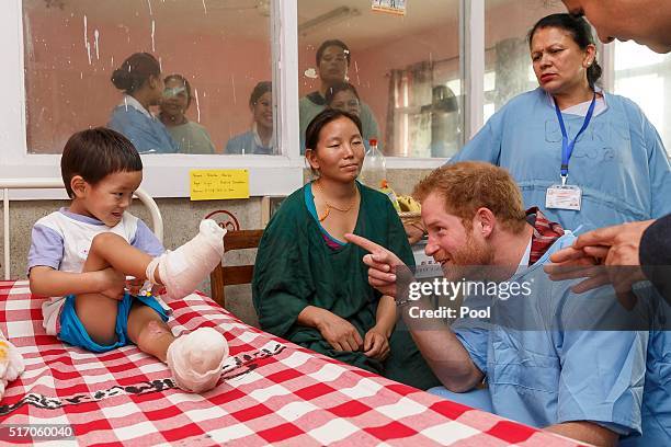 Prince Harry meets young burns victim Pemba Sherpa, 5 and mother Doma at Kanti Children's Hospital on the final day of his tour of the country on...