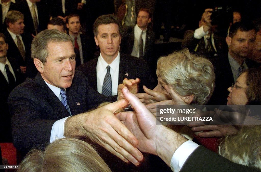 US President George W. Bush greets supporters afte