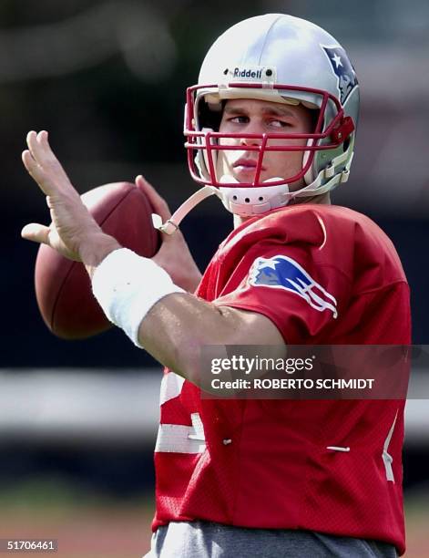 New England Patriots' quarterback Tom Brady throws a football during his team's practice at a local university campus in New Orleans, Louisiana 31...