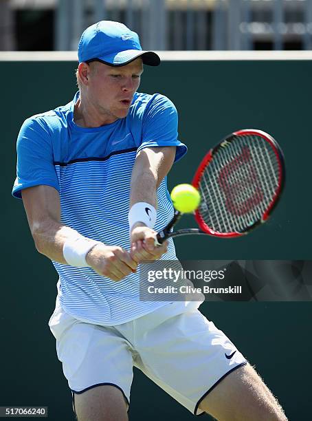 Kyle Edmund of Great Britain plays a backhand against Jiri Vesely of the Czech Republic in their first round match during the Miami Open Presented by...