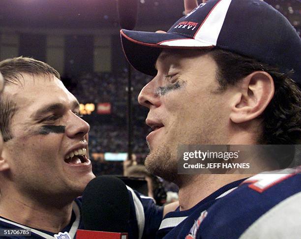New England Patriots quarterbacks Tom Brady and Drew Bledsoe celebrate their team's victory over the St. Louis Rams 03 February, 2002 in Super Bowl...