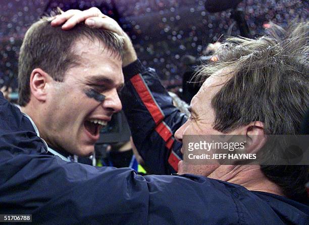 New England Patriots' quarterback Tom Brady celebrates with head coach Bill Belichick after their win over the St. Louis Rams 03 February, 2002 in...