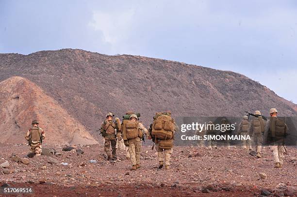Marines take part in a military drill on the Golfe of Tadjoura beach in Djibouti, on March 23, 2016. / AFP / SIMON MAINA