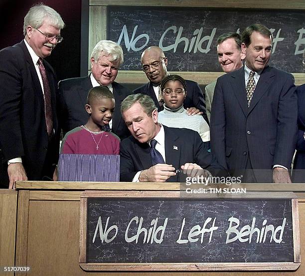 Nine year old Tez Taylor asks US President George W. Bush a question during a bill signing ceremony of the "No Child Left Behind" Act, an education...