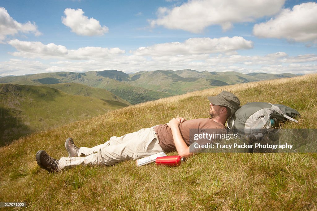 A man relaxes in the English Lake District.