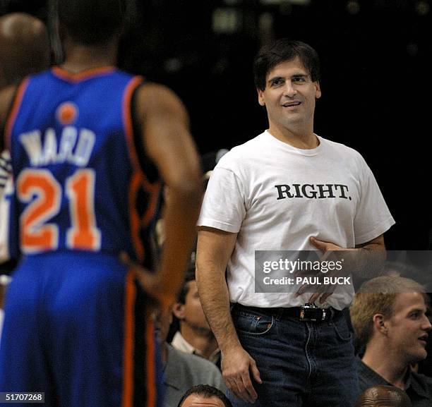 Dallas Mavericks owner Mark Cuban watches the last few minutes of his team's victory over the New York Knicks at American Airlines Center in Dallas,...