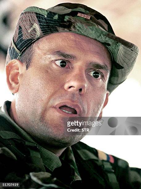 Photo taken 20 February 2001 of the commander of the Autodefensas Unidas de Colombia , Carlos Castano, while he speaks with the press in Uraba,...