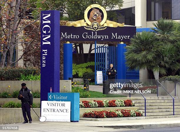 Security personnel stand outside the Santa Monica-based headquarters of Metro-Goldwyn-Mayer studio 15 January controlled by billionaire Kirk...