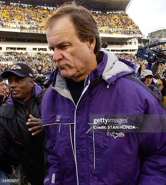 Baltimore Ravens' coach Brian Billick heads off the field after his team lost to the Pittsburgh Steelers, 27-10 in the AFC Divisional Playoff 20...