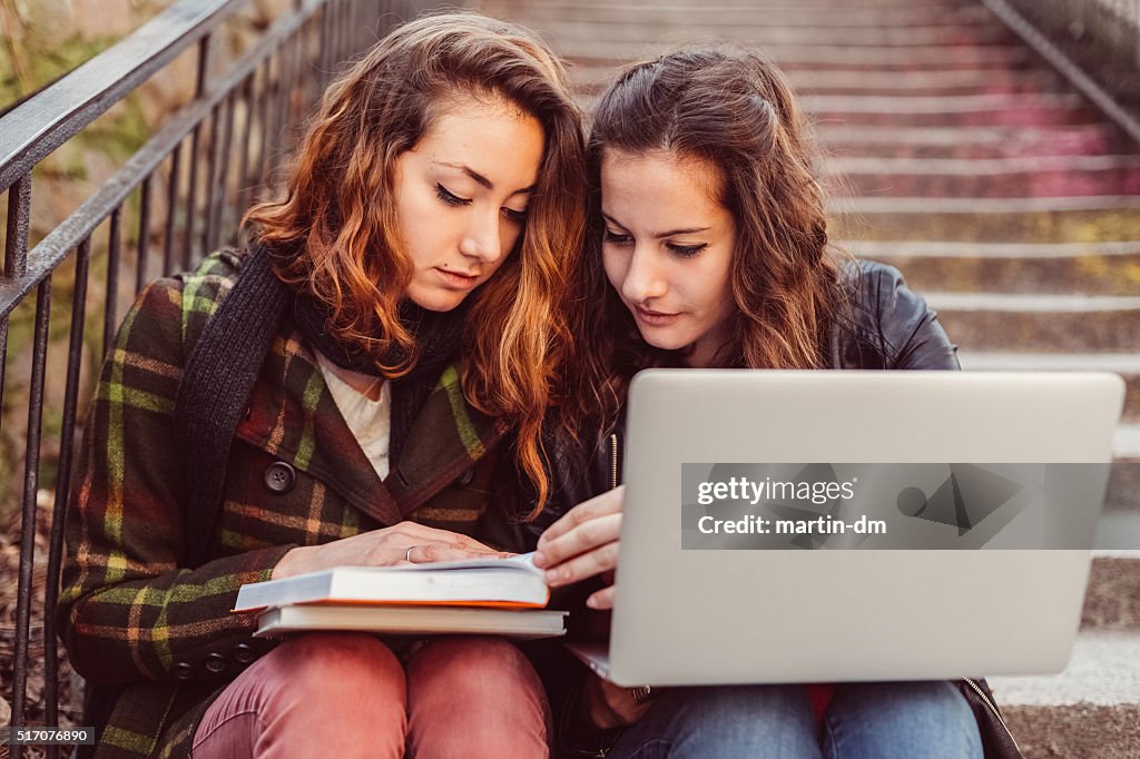 Young girls doing the homeworks together