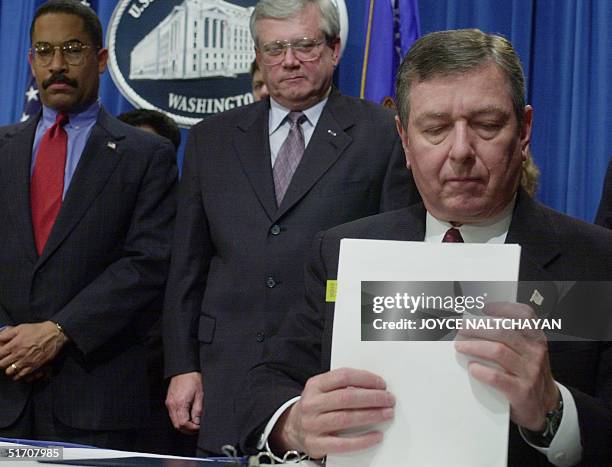 Attorney General John Ashcroft concludes a signing ceremony of the T visa regulation, designed for certain human trafficking victims who cooperate...