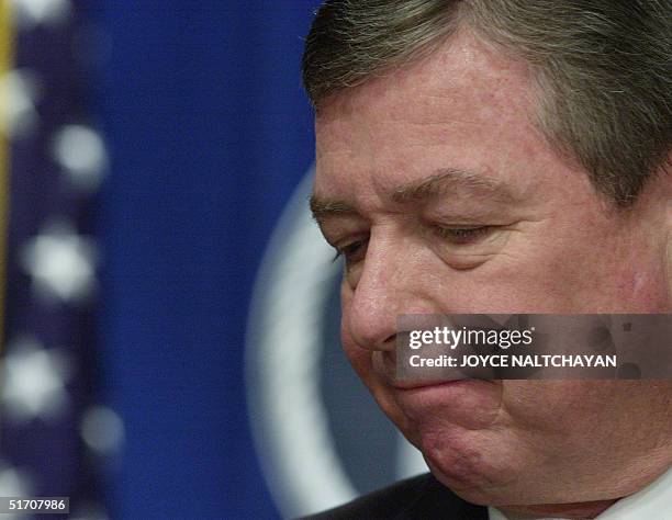 Attorney General John Ashcroft concludes a signing ceremony of the T visa regulation, designed for certain human trafficking victims who cooperate...