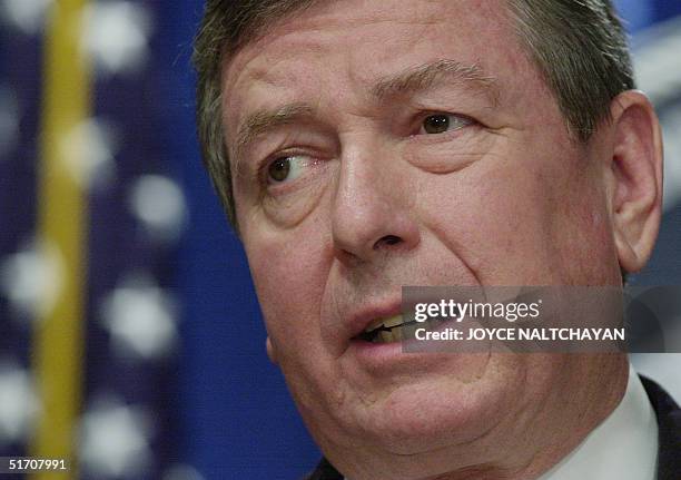 Attorney General John Ashcroft concludes a signing ceremony of the T visa regulation, designed for certain human trafficking victims who cooperate...