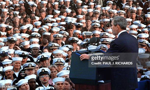 President George W. Bush addresses crewmen -- returned from duty in Operation Enduring Freedom -- on the flight deck of the USS Enterprise 07...