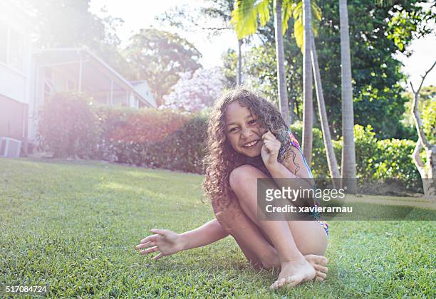 aboriginal girl having fun in the garden - aboriginal girl stock pictures, royalty-free photos & images
